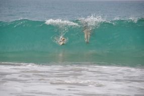 scuba diving in turquoise high wave