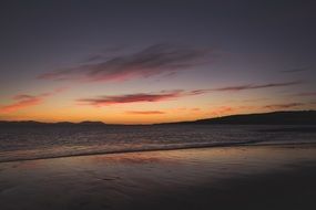 Sunset on the beach of the ocean