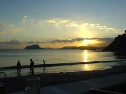 tourists late at night on the beach