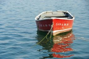 red boat on the beach at San Vicente de la Barquera