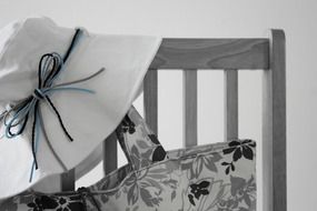 black and white photo of the chair with a bag and panama
