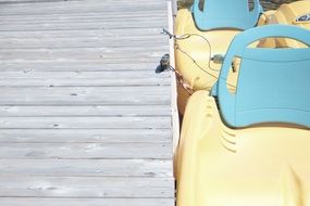 paddle boat by the wooden pier