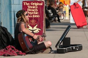 street musician on a venetian beach