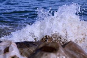 rock in water splashes close up