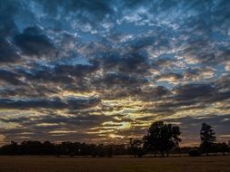 cloudy sunset sky over the field