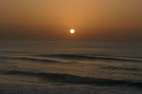 Atlantic Ocean on the background of the sunset in France