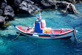 boat in santorini island ocean waters