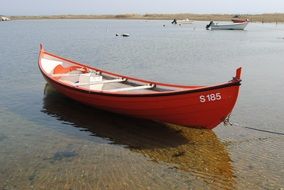 unusual beauty red boat