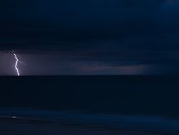 thunderbolt, lightning in dark seascape