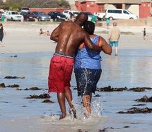 lovers walking on a beach