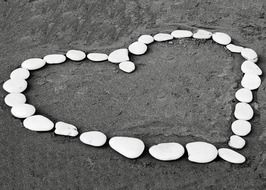 white pebbles in the shape of a heart