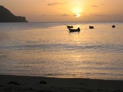 Fishing boats floating on a calm sea