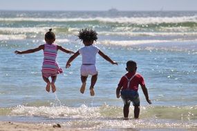 children play by the water