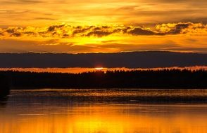 Orange sunset over the lake in Kuusamo