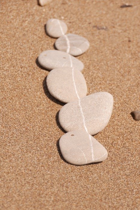 line of stones on the beach
