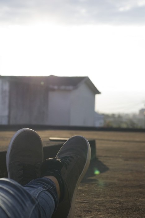 feet in shoes on the terrace