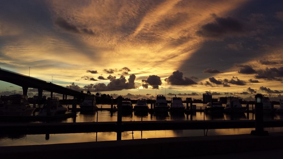 boats in harbor at dramatic sunset, usa, florida, clearwater
