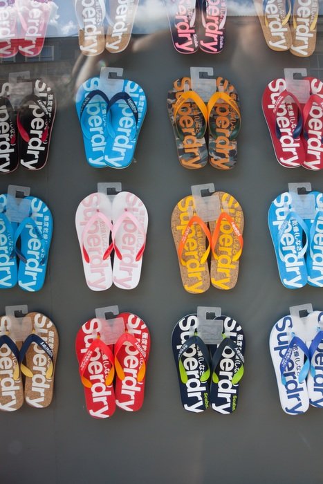 colorful beach shoes at window