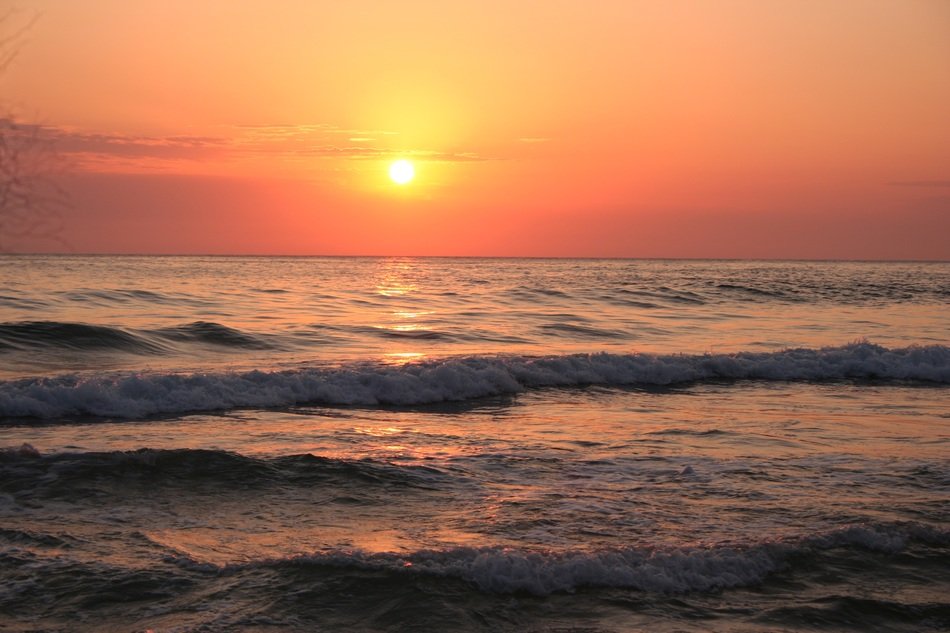 Wavy ocean at the sunset