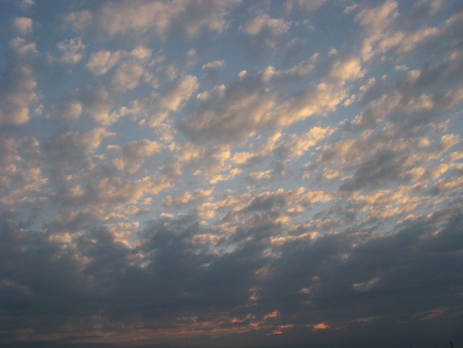 little clouds in the sunset sky