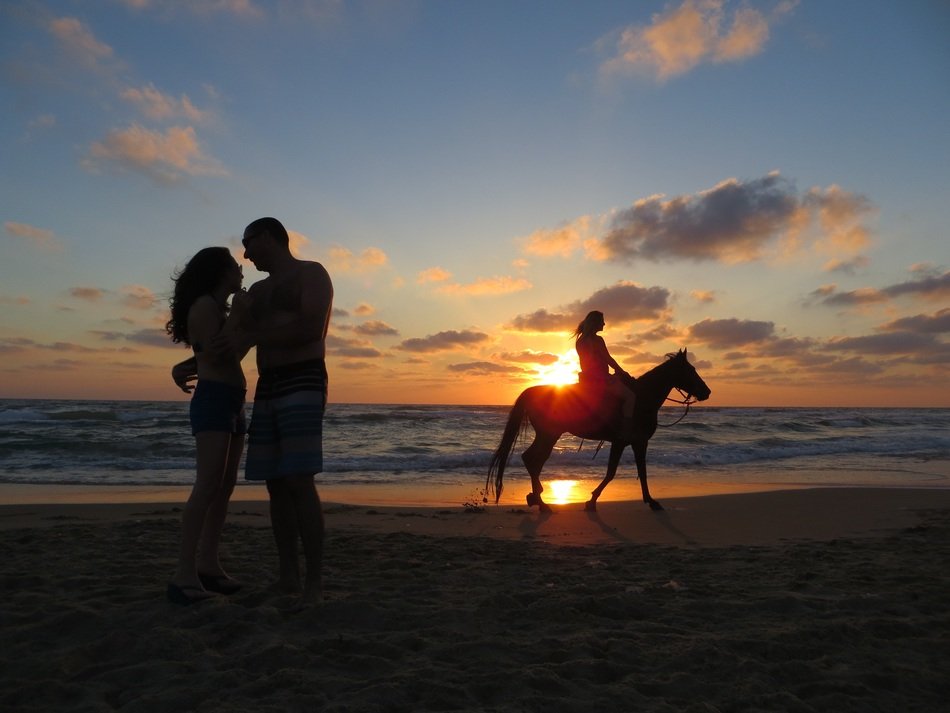 couple in love on the beach at sunset