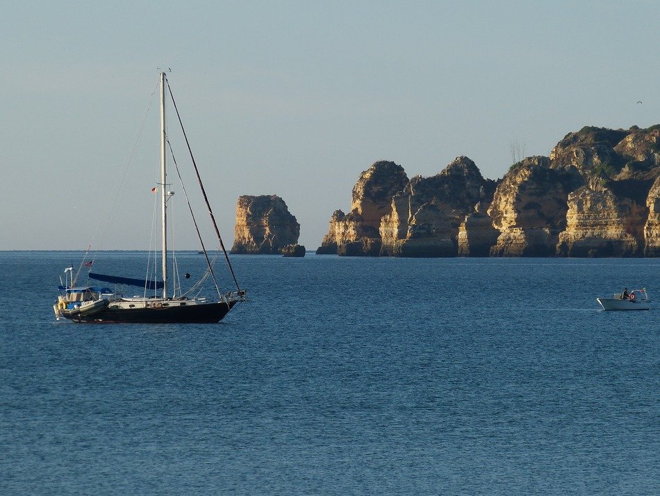 ship in the sea on the background of rocks in Lagos