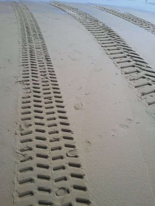 tire tracks on the coast of holland