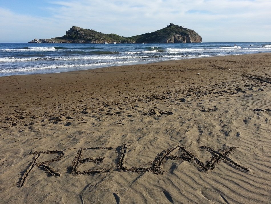inscription relax on the sand by the sea