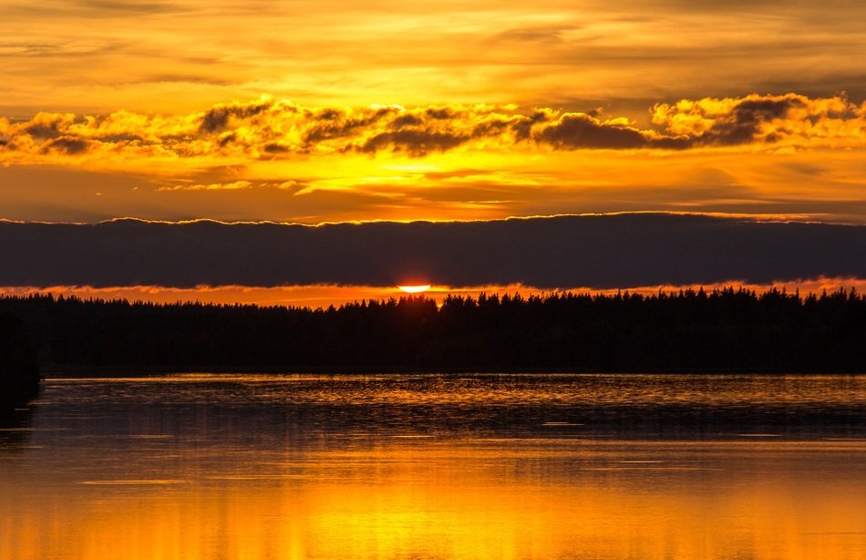 Orange sunset over the lake in Kuusamo