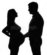 Foto Stock Silhouette Of The Pregnant Woman With Husband Isolated On