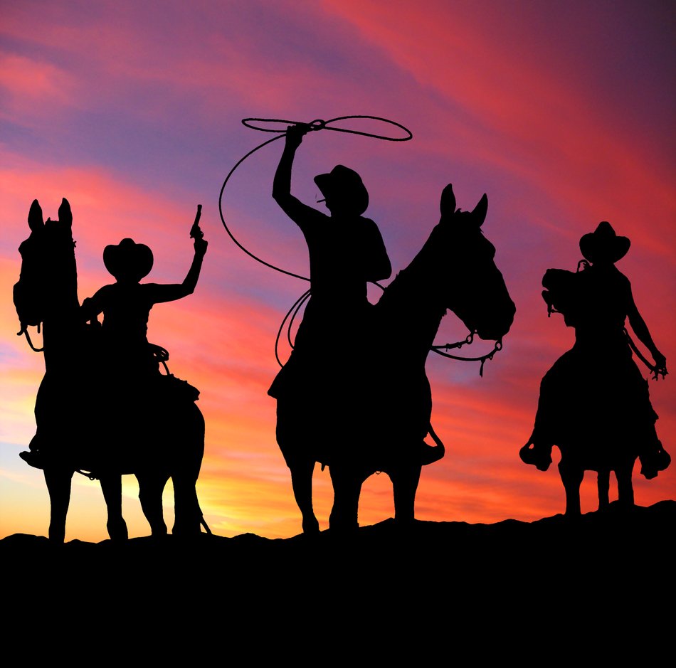 silhouettes of three cowboys on a background of purple-pink sunset