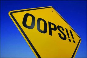 oops!! on the yellow road sign