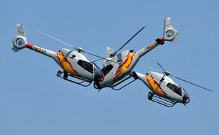 clipart of the helicopters on a sky