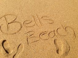 inscription on sandy sand