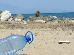 plastic bottle on a polluted beach