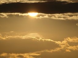 setting sun between the clouds