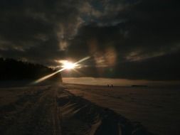 winter sunset over snowy landscape
