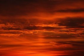 dark clouds in red sunset sky