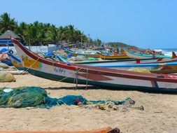 colorful boats on sand beach scene