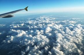 aircraft wing above the clouds