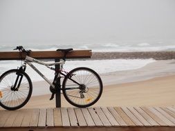 bike on the pier on the beach in portugal