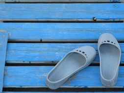 women's beach sandals on the blue floor