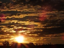 golden sunset cloudy sky scene