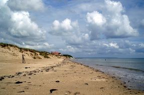 fluffy clouds over utah beach france normandy