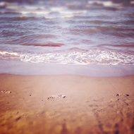 footprints near the surf