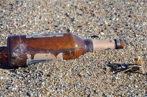 brown bottle on the beach
