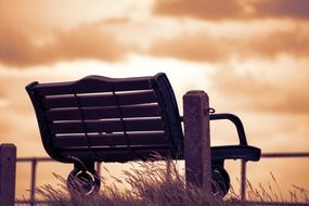 wooden bench at sunset