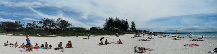 people are relaxing on the beach in Byron bay