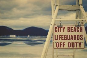 lifeguard sign on the beach