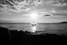 black and white photo of a ship at sea